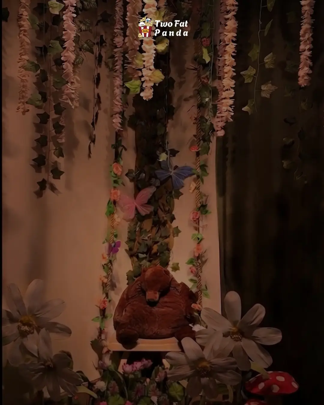 Cozy forest-themed private cinema room with flowers and a teddy bear